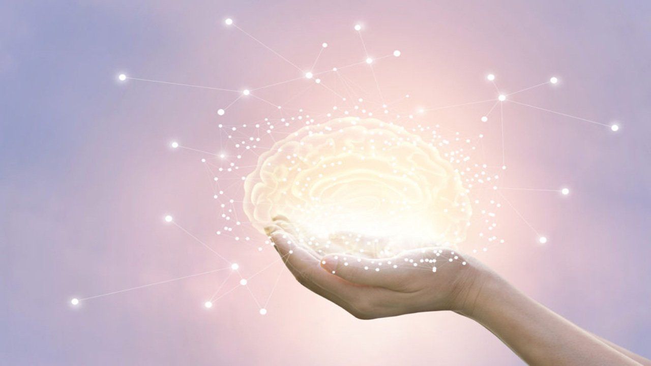 A person is holding a light in their hand.