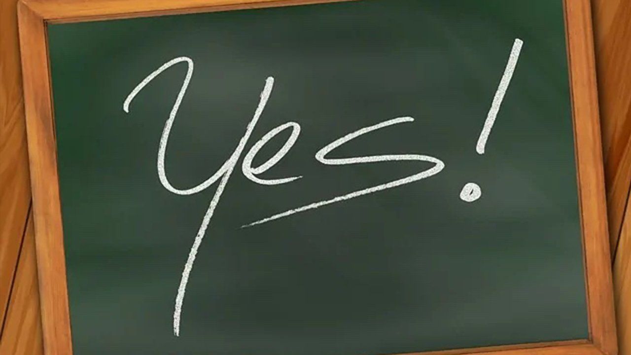 A blackboard with the word yes written on it