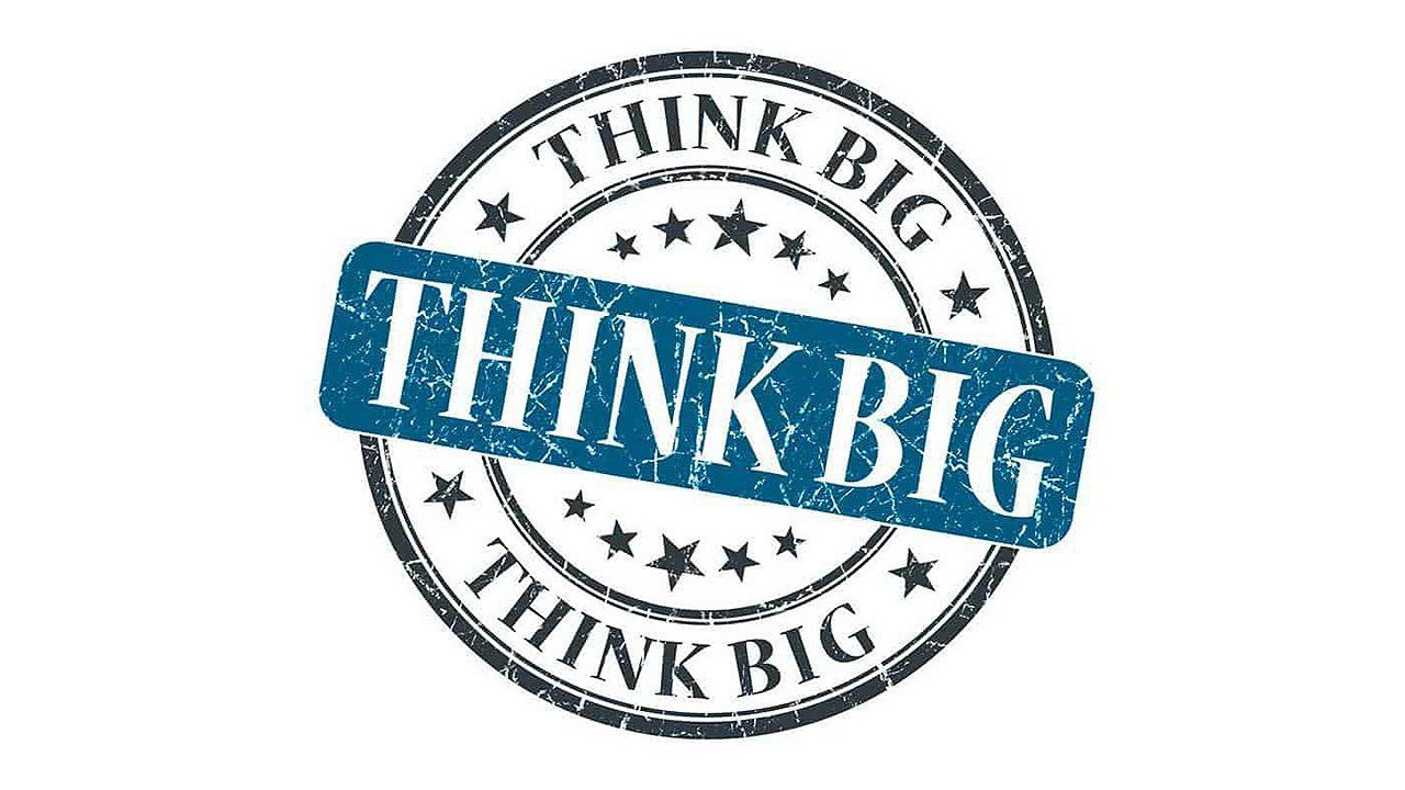 A blue stamp that says think big on it