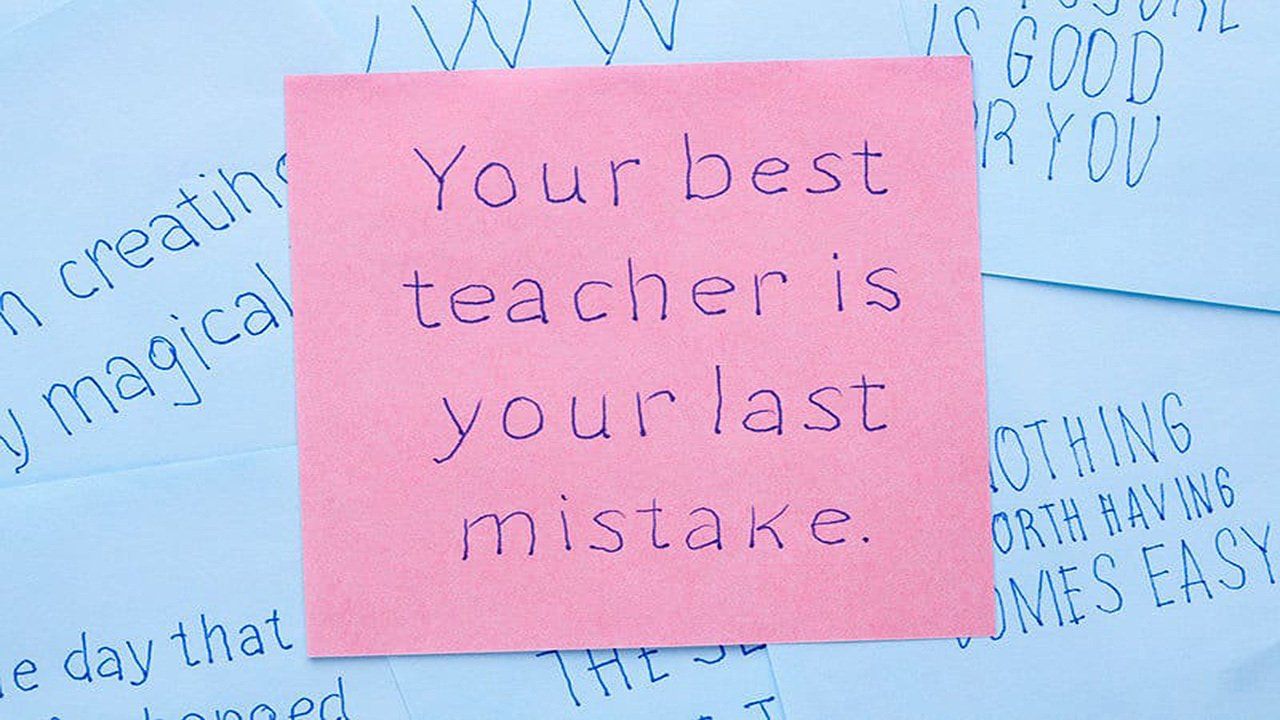 A post it note that says your best teacher is your last mistake
