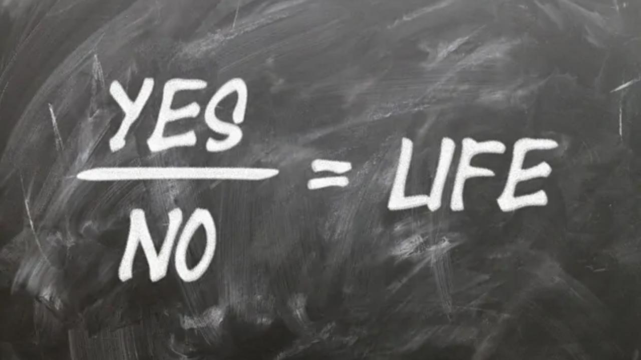 A blackboard with the words yes and no written on it.