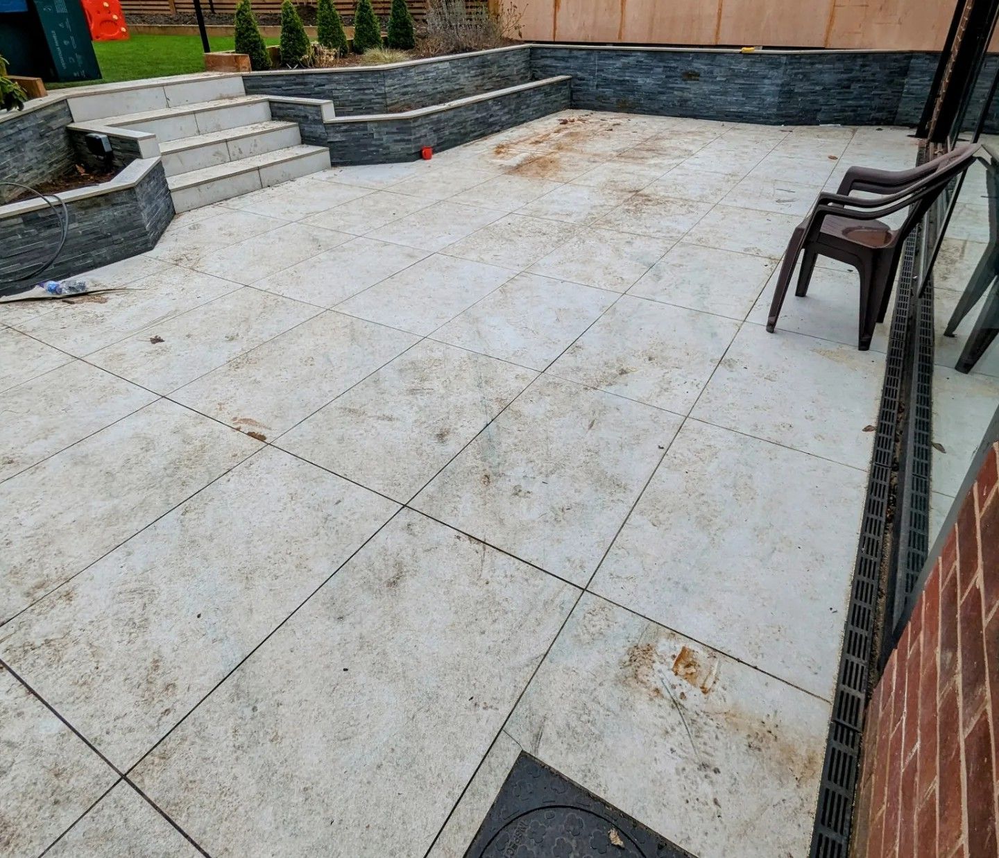 Porcelain tiled patio deep  cleaning in Manchester, including grout cleaning