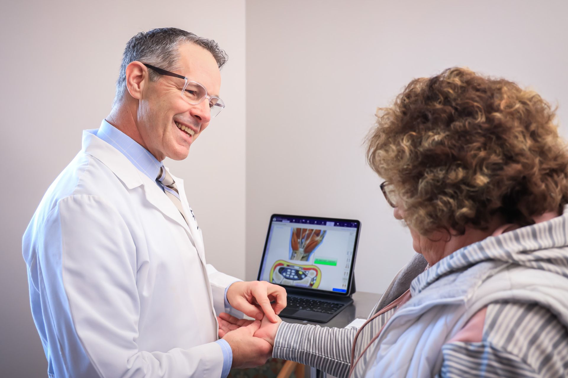 Richard Baumann, M.D. with patient