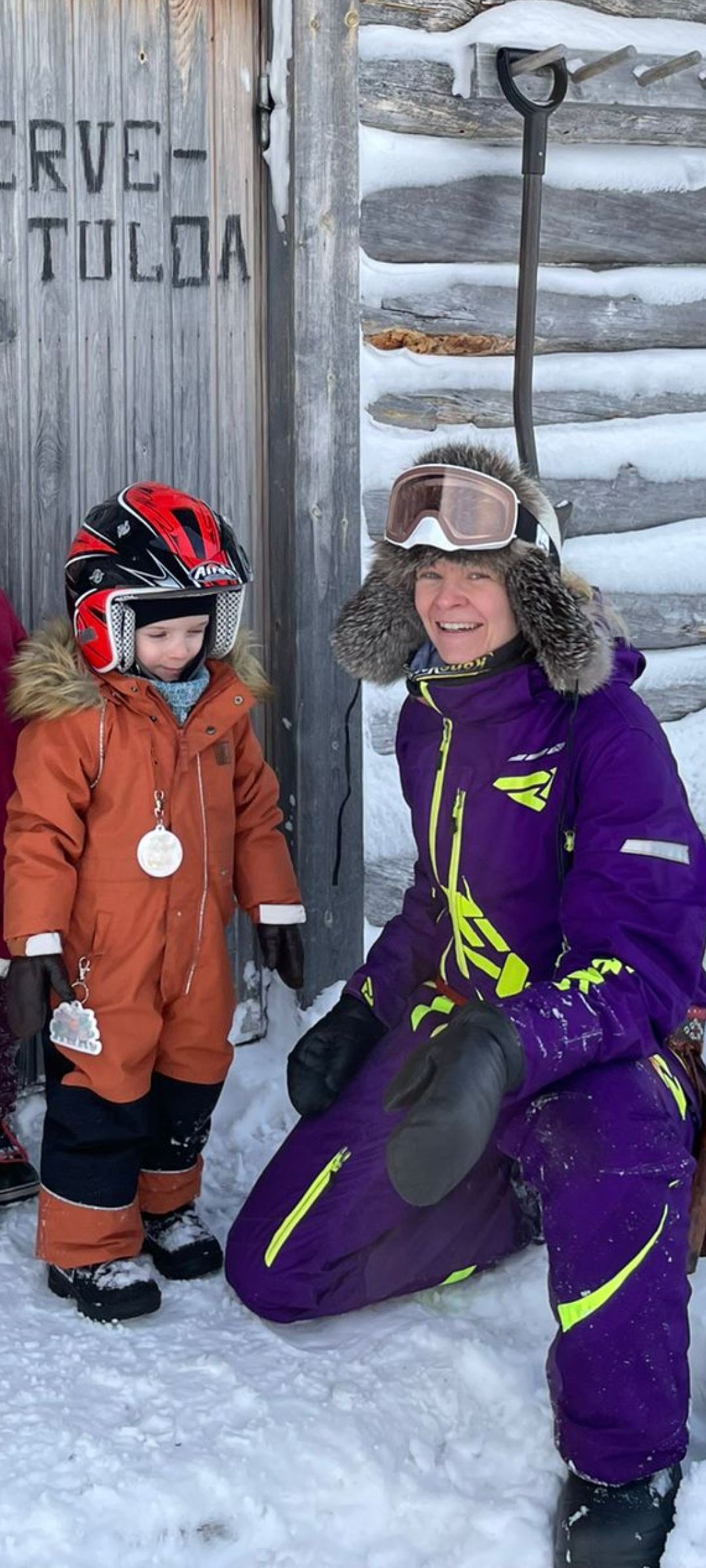 family snowmobiling in Paistunturi wilderness area
