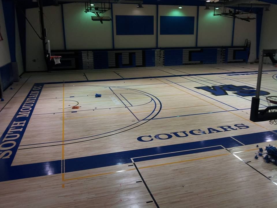A basketball court with the word cougars on it