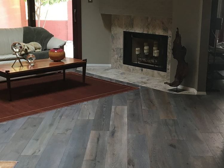 A living room with a fireplace and a couch