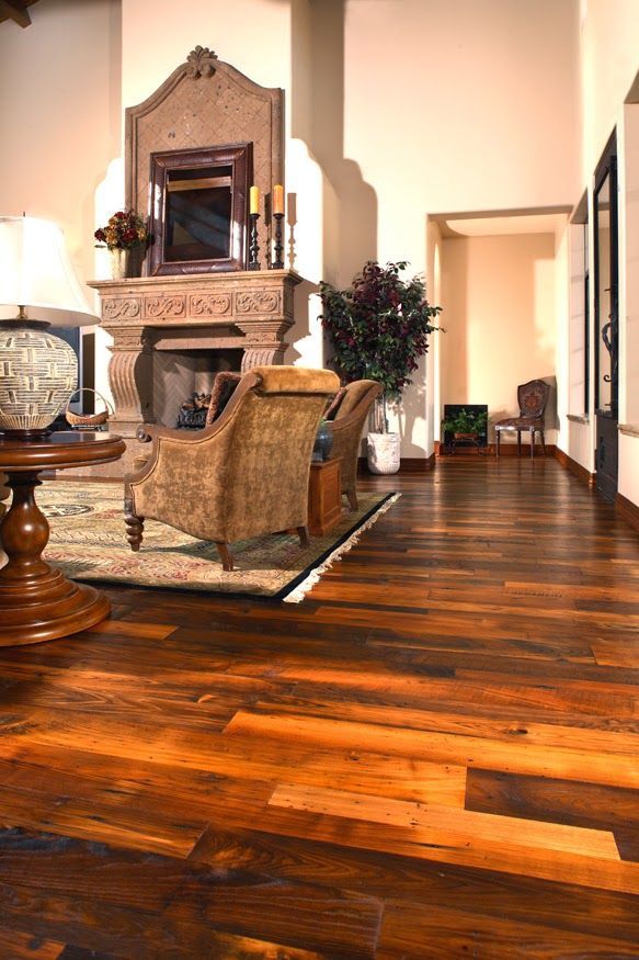 A living room with hardwood floors and a fireplace
