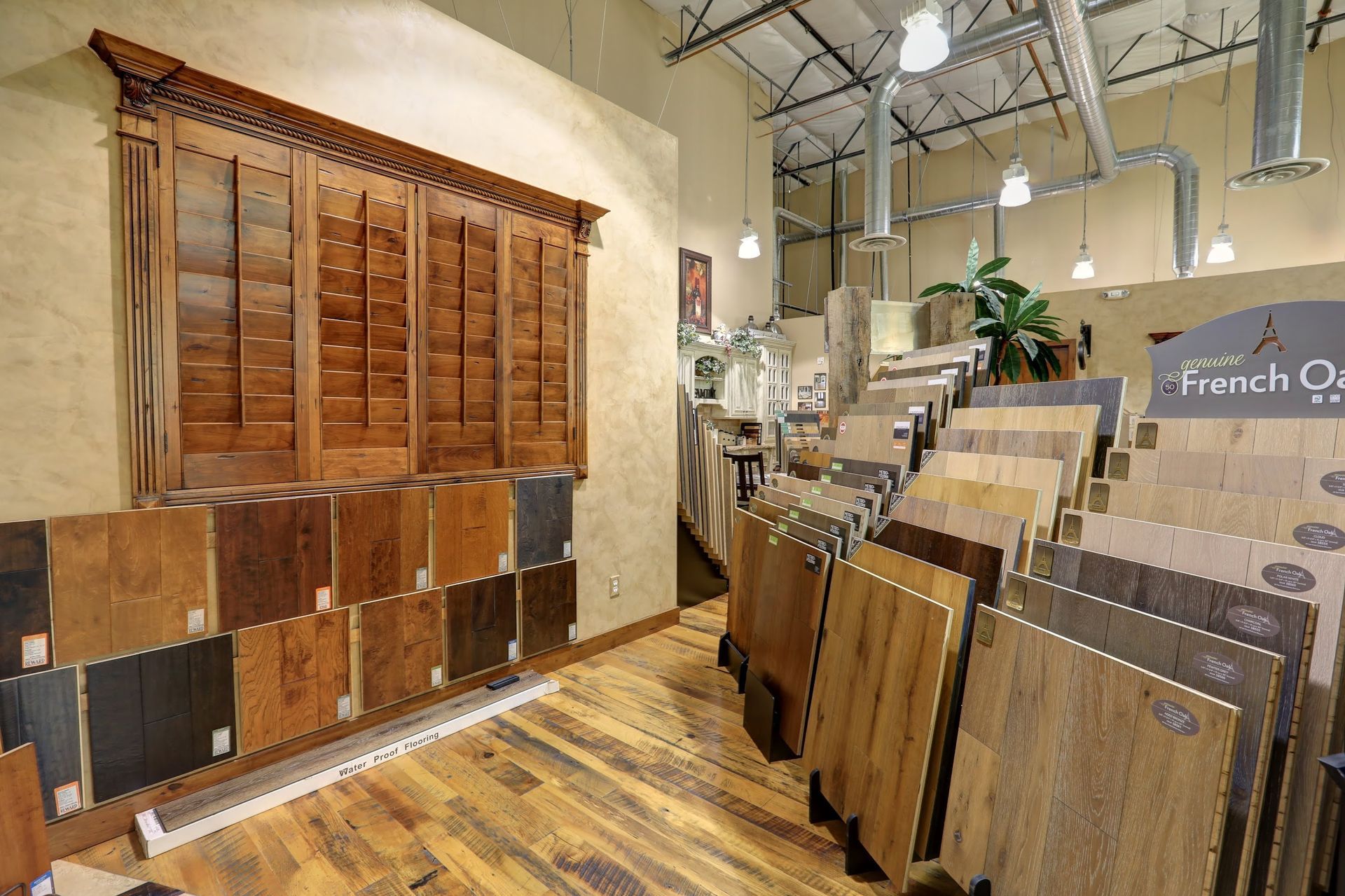 A room with a lot of wooden floors and a sign that says french oak