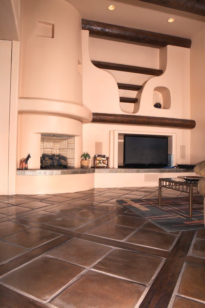 A living room with a fireplace and a flat screen tv