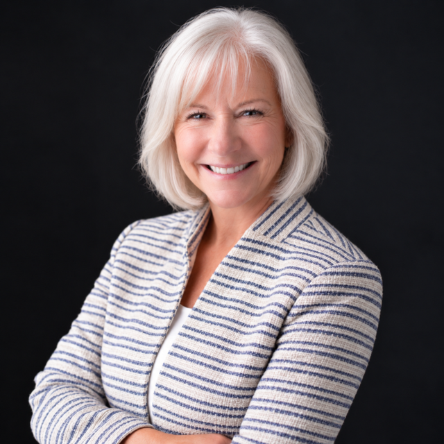 smiling woman in blue and white striped suit