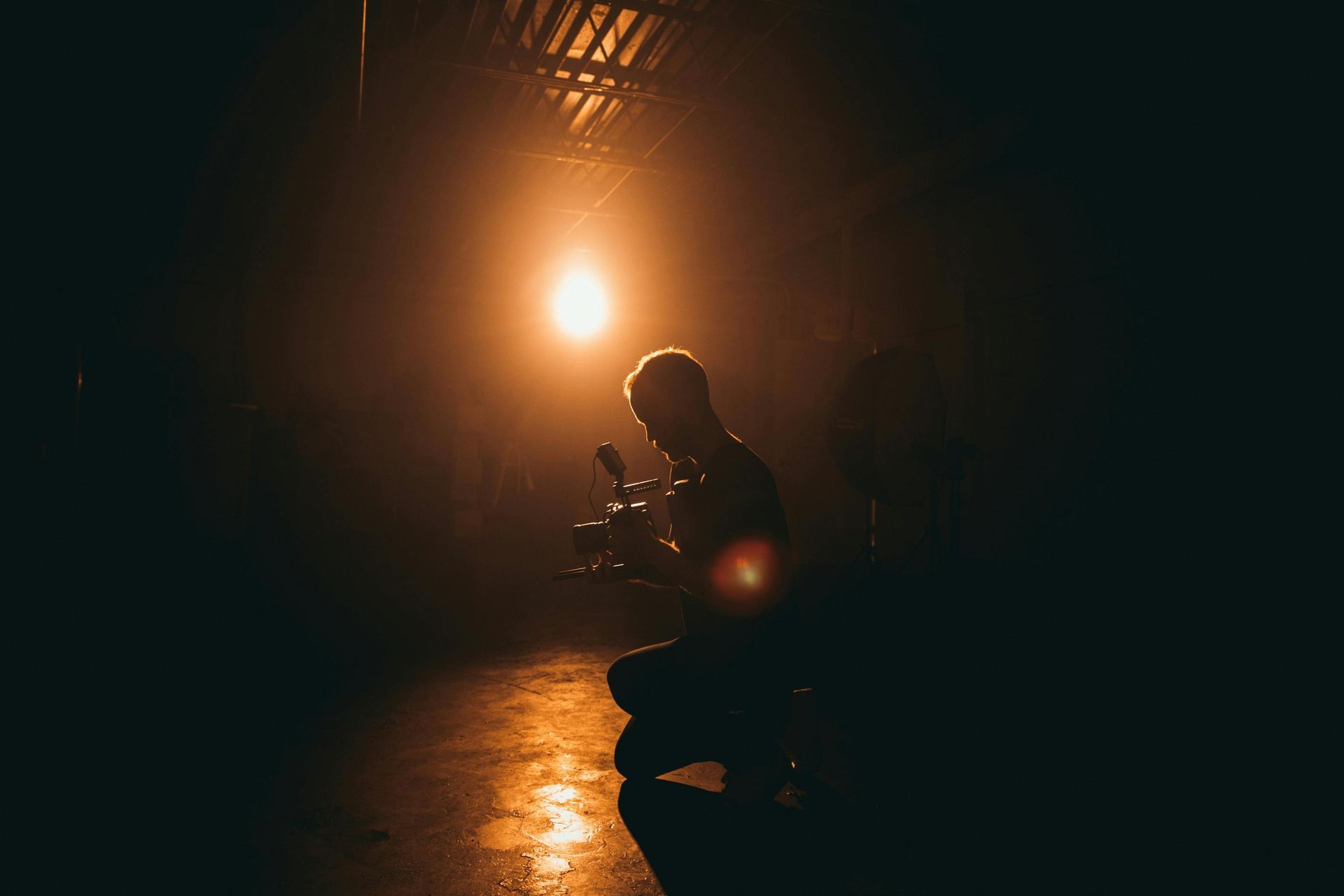 A filmmaker focused on capturing the perfect shot, representing the dedication to craft at Brite Point Media
