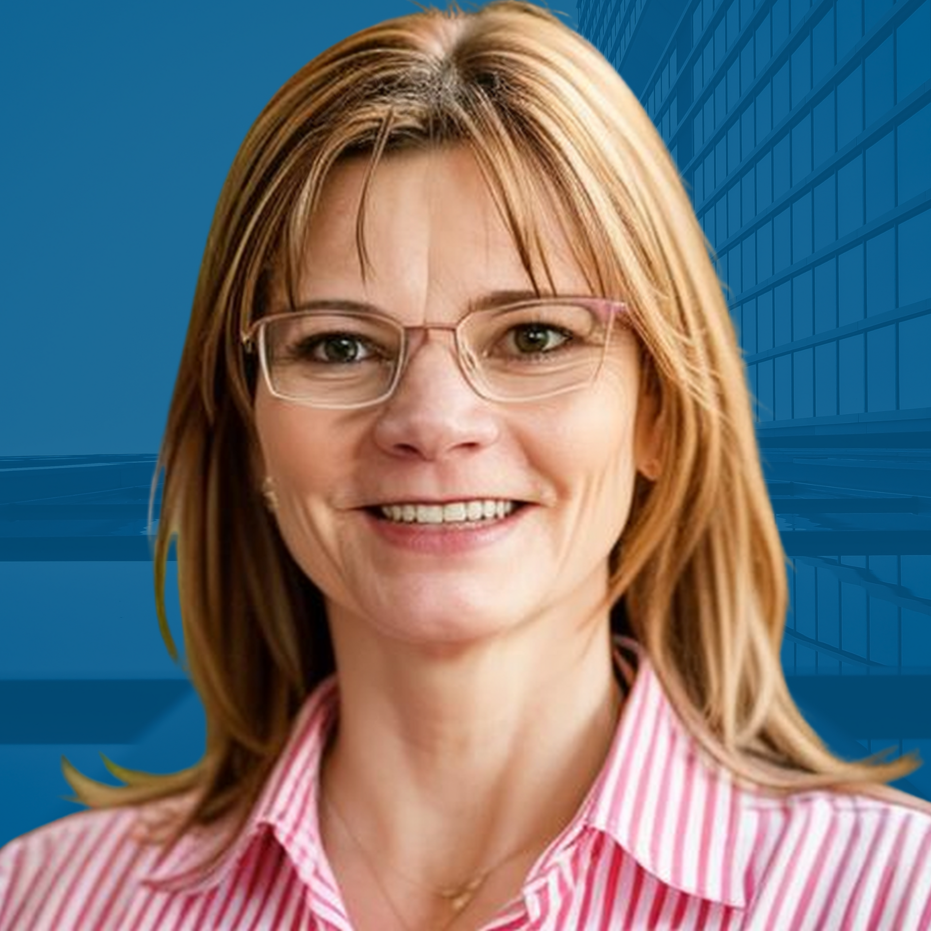 Woman wearing glasses and a striped shirt, smiling in front of a blue building backdrop.