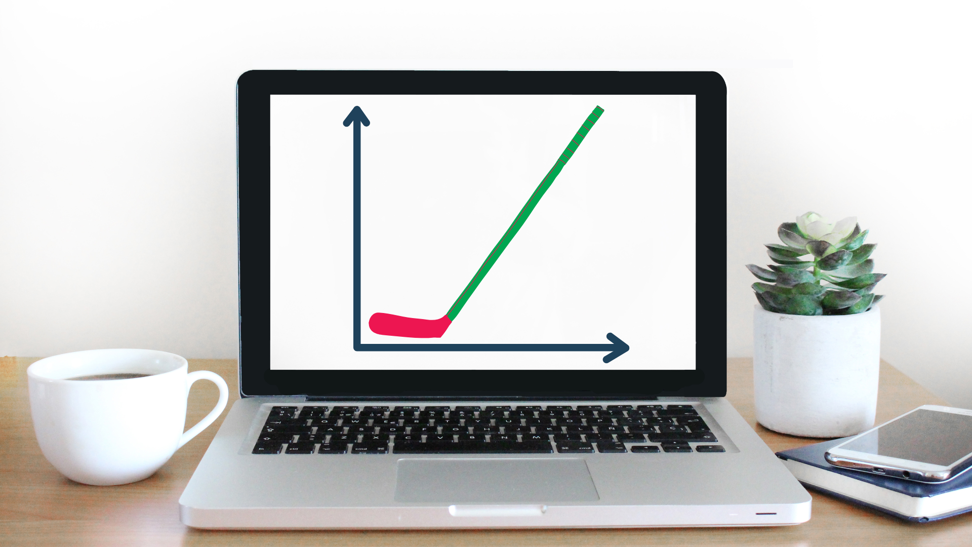 Laptop with graph depicting a curve; x-axis and y-axis. Green line rises.
