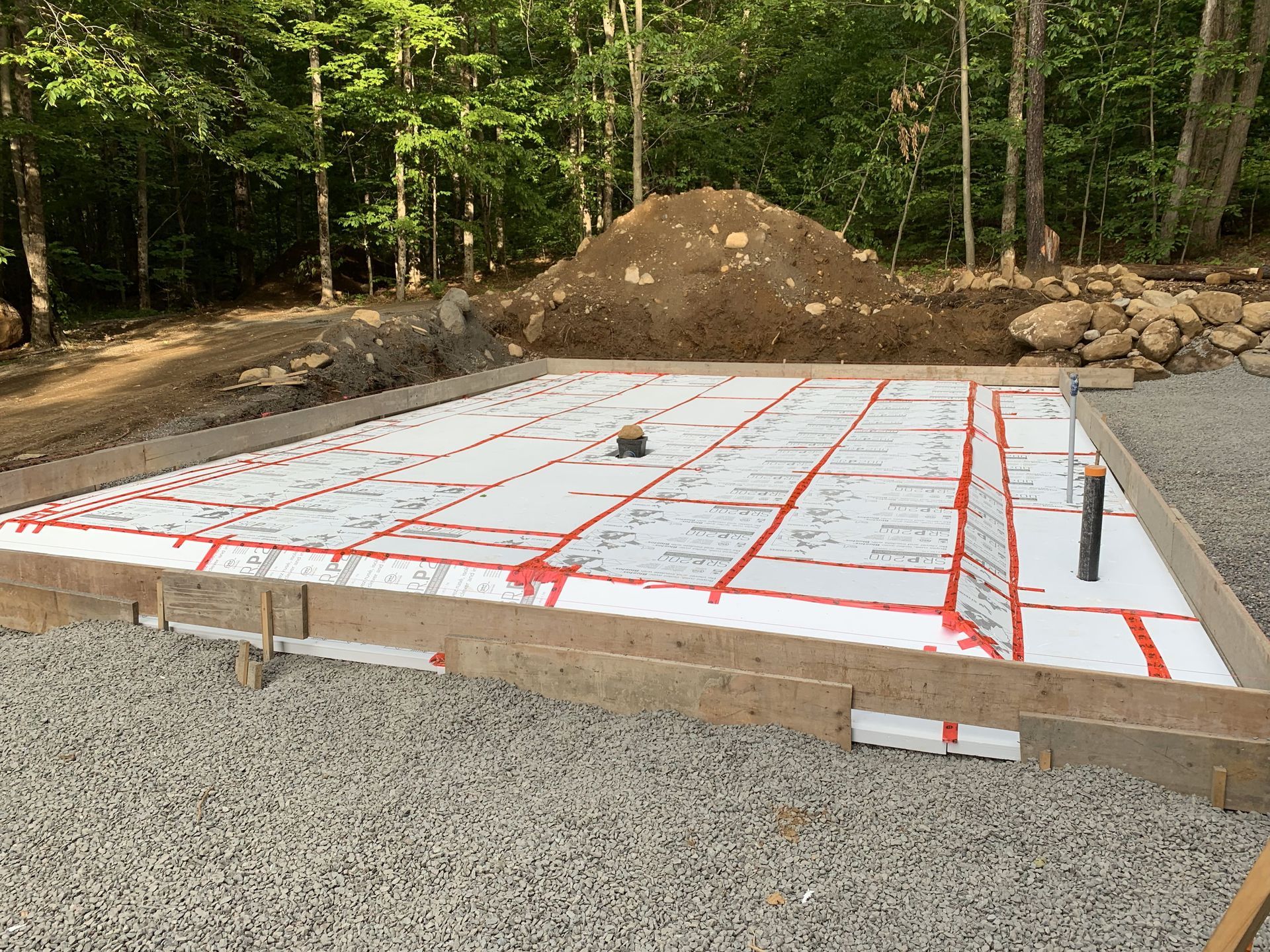 men using a level tool to ensure the concrete surface is perfectly level