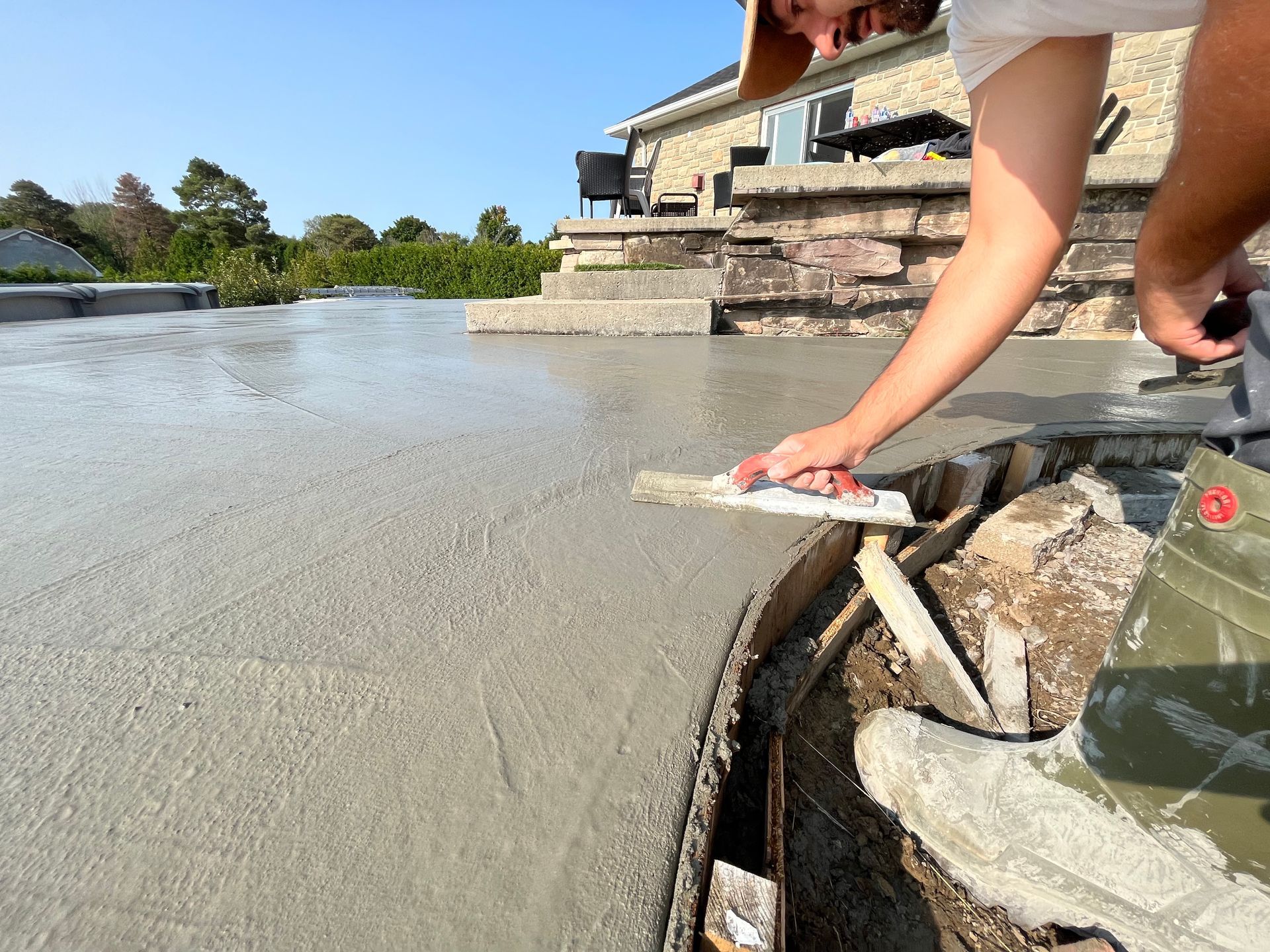 worker plastering the terrace