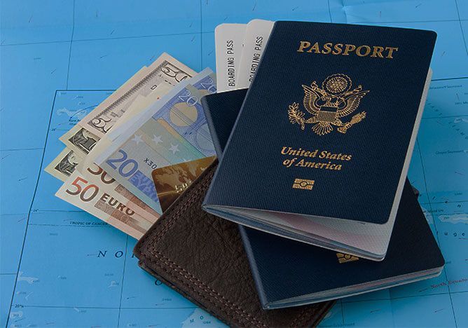 U.S. passports with euro banknotes on a blue background