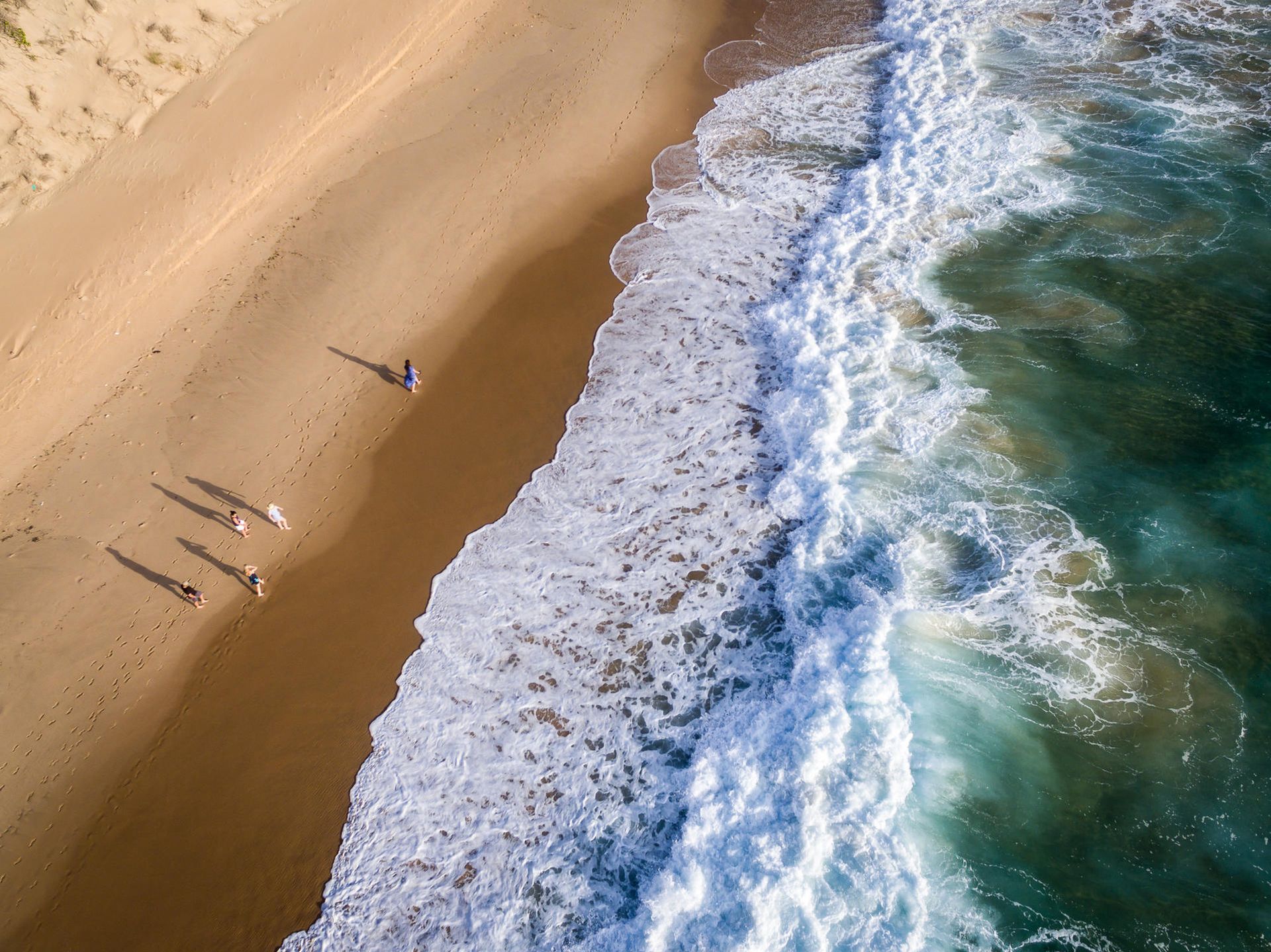Barra Beach in Moz offers a perfect backdrop for relaxation and water sports amidst stunning coastal scenery.