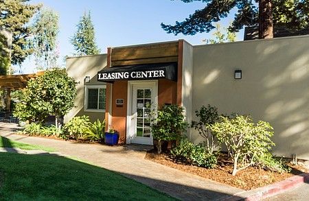 A building with a sign that says leasing center on it