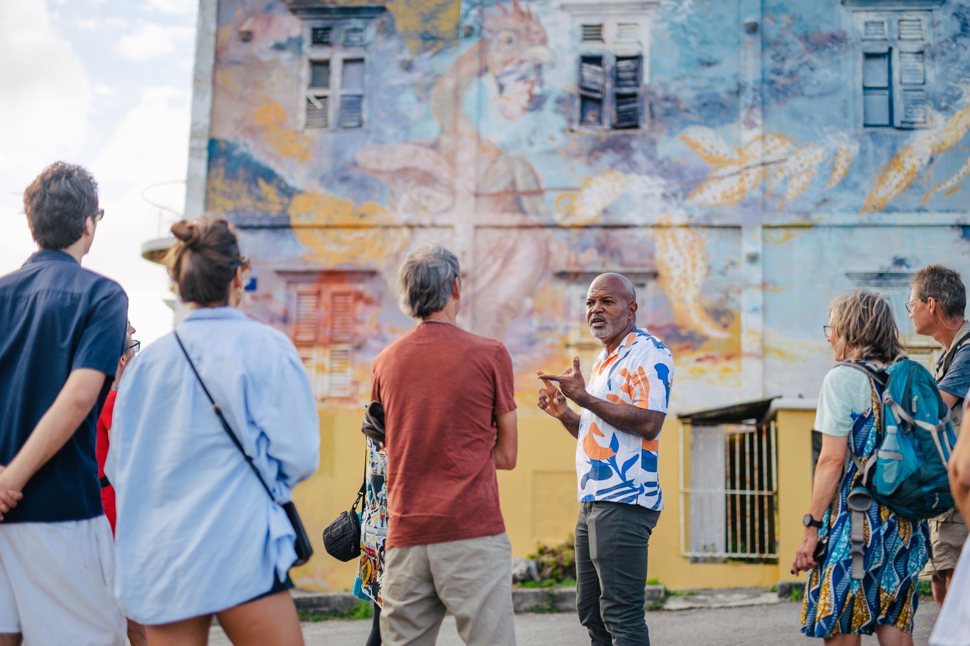 Neighborhood walking tour through the colorful streets of Otrobanda Curaçao, guided experience near Bario Hotel