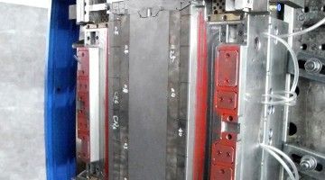 A close up of a machine with a lot of wires coming out of it.