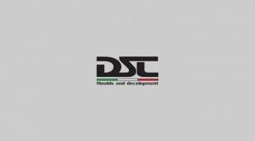 A logo for a company called dsc shields and development on a gray background.