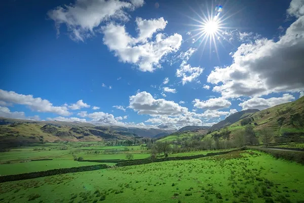 Blue sky and green fields on a sunny summer’s day.