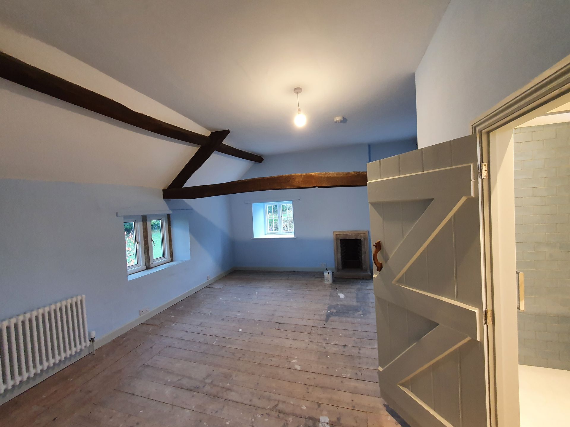 Large attic room redecorated with beams painted in sadolin teak stain