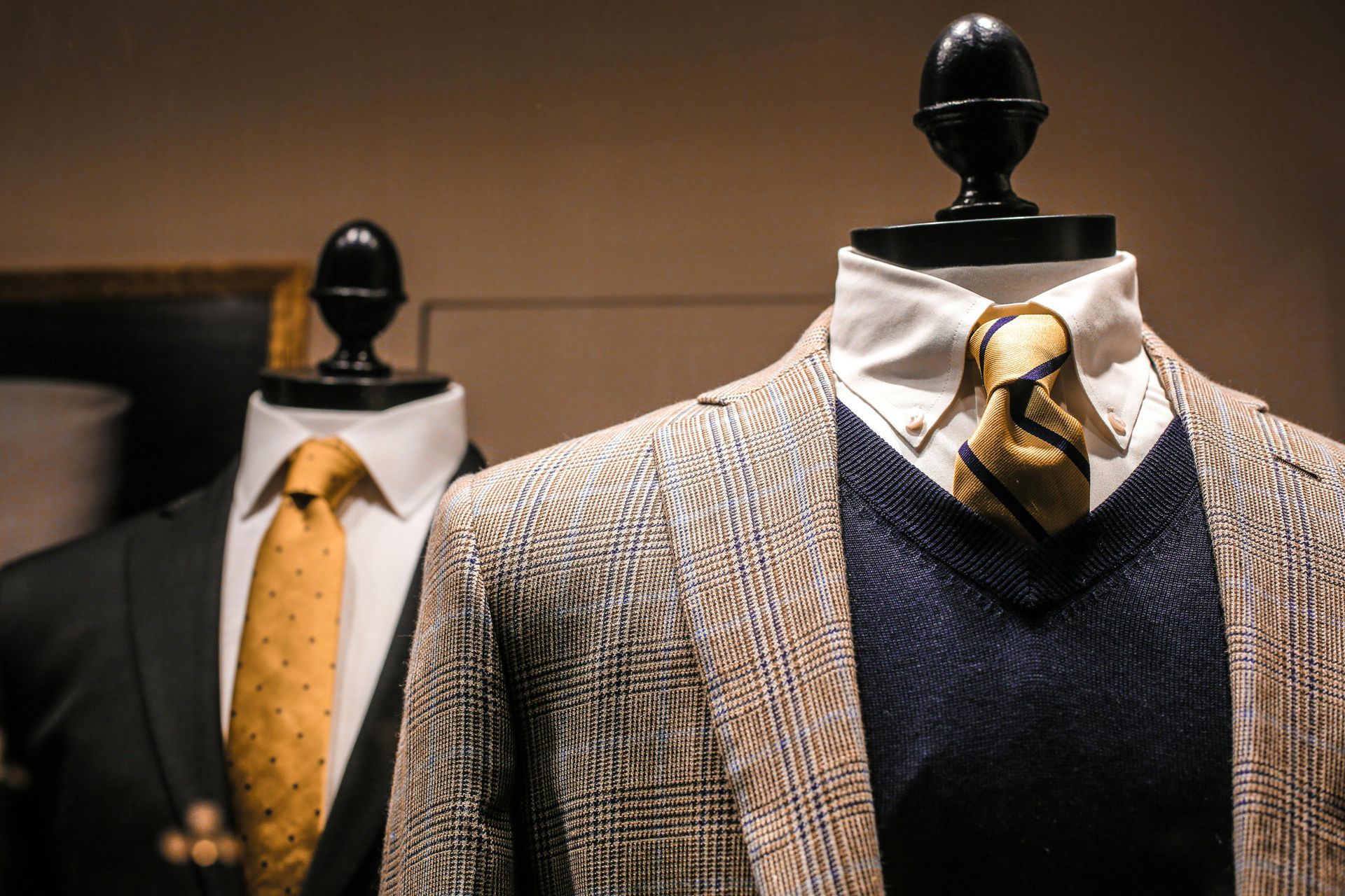 two premium mens blazers on display