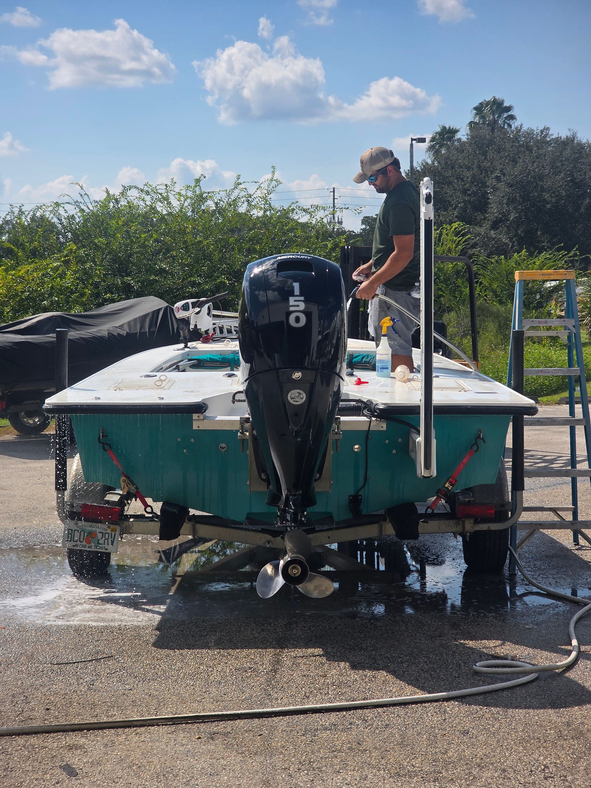 A bottle of oil is being poured into a car engine.
