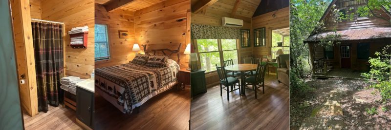 Wood-paneled cabin interior with a bed, dining table by large windows, and a stone patio outside
