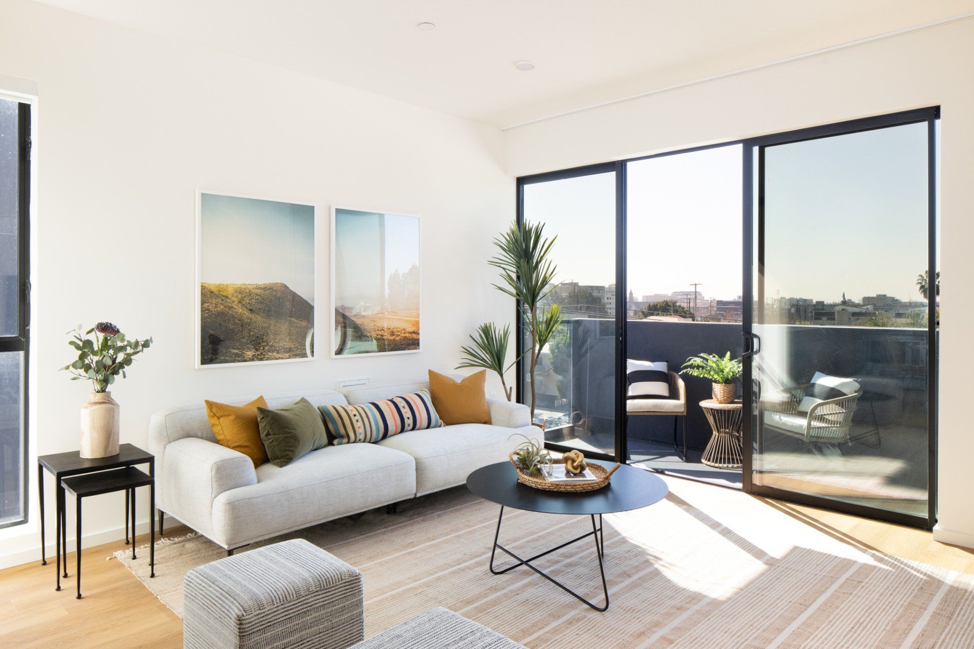 Spacious 1-bedroom apartment living room with balcony view at Frame Downtown Culver City