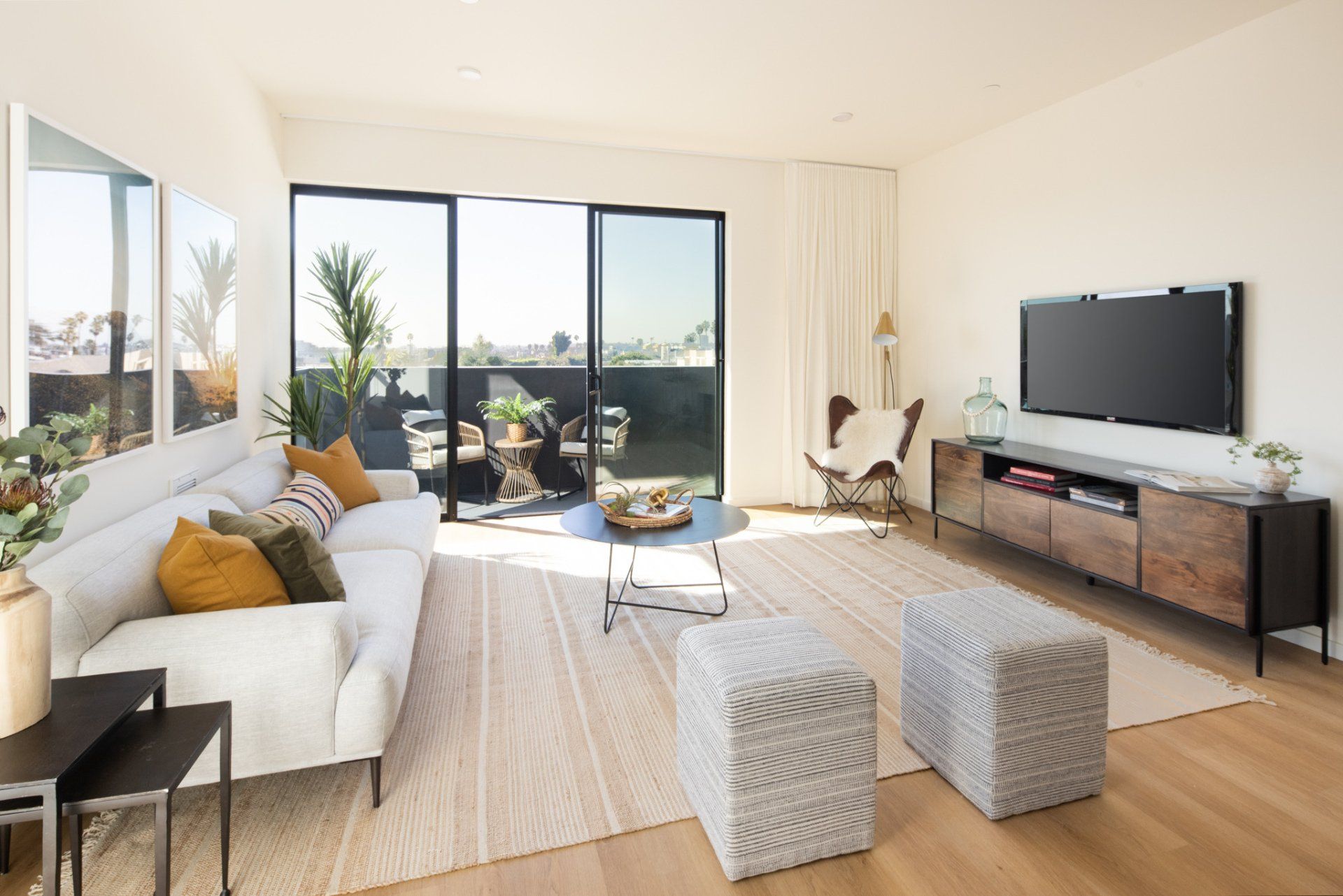 Spacious 1-bedroom apartment living room with balcony view at Frame Downtown Culver City