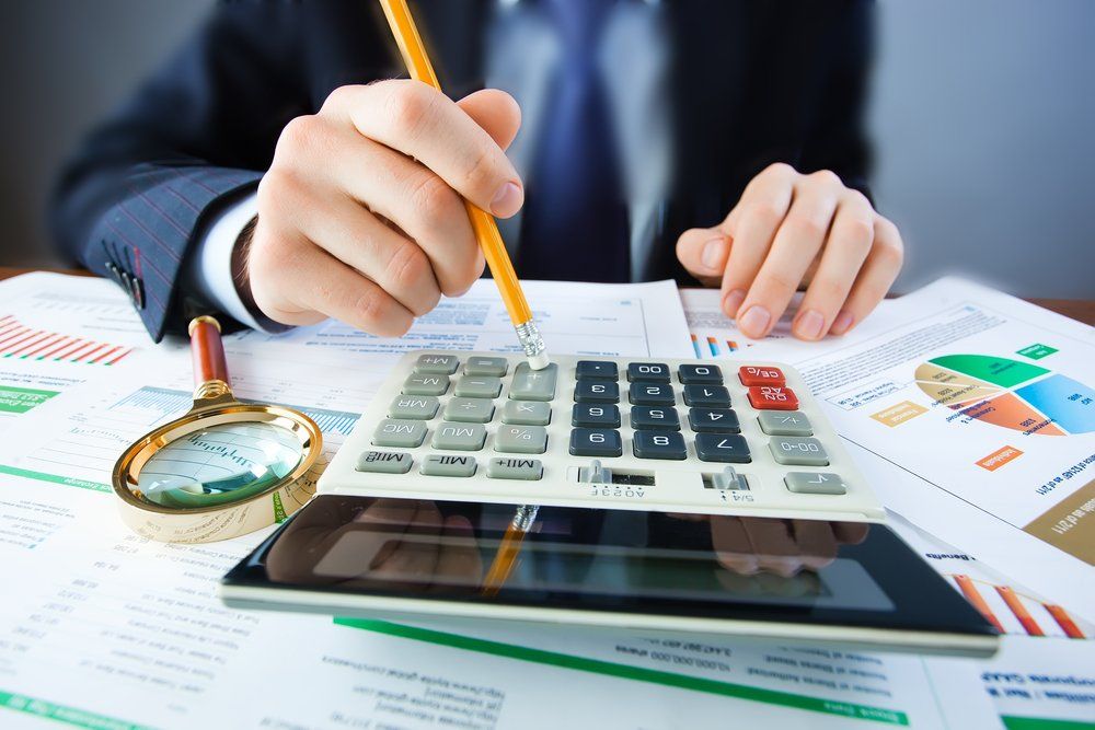 Man With Documents And Calculator
