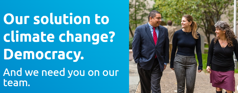 Blue ad reads “Our solution to climate change? Democracy” beside three people walking outdoors.