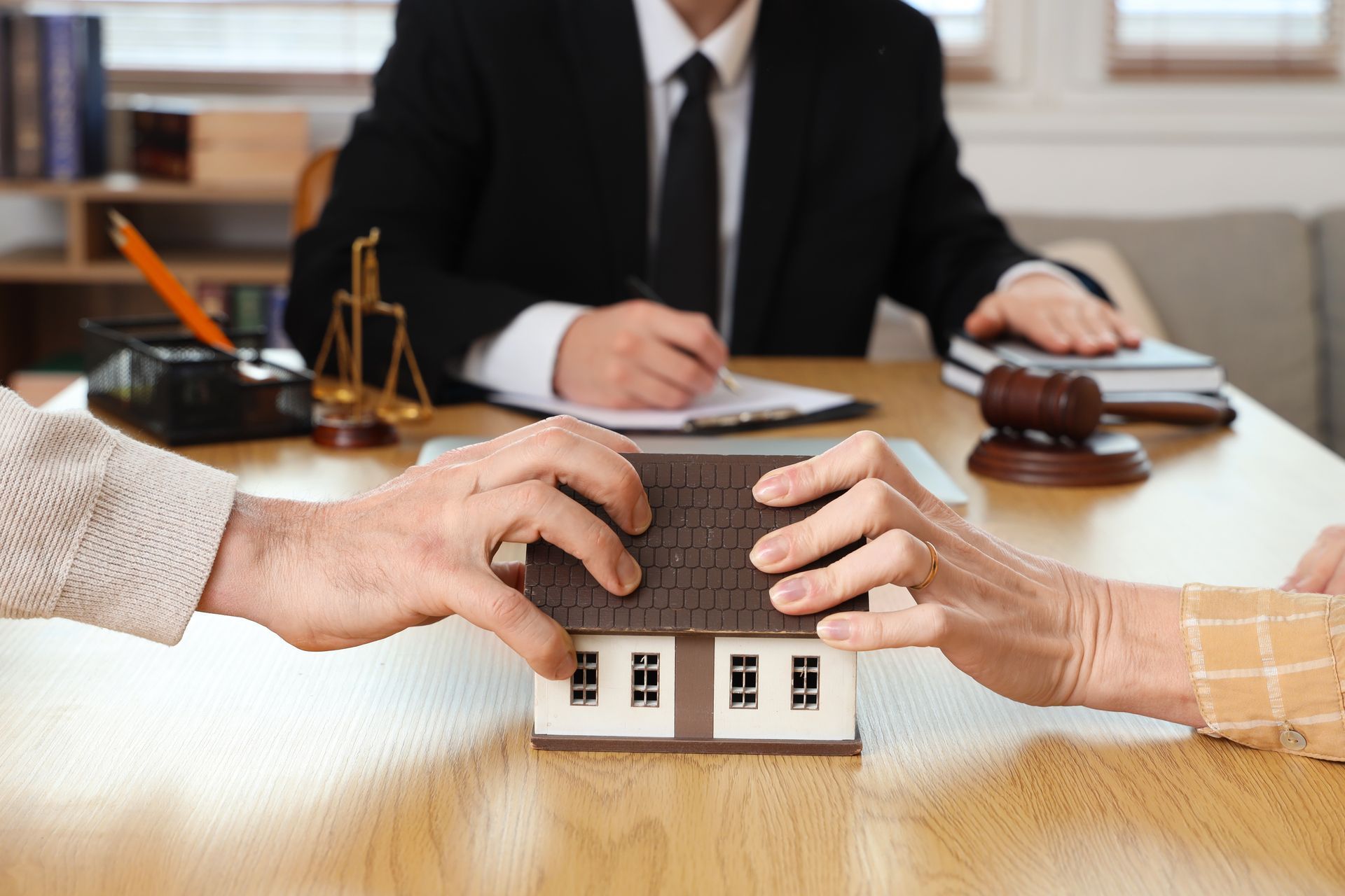 Divorce law consultation with couple disputing property in office. Divorce law consultation with couple disputing property in office.