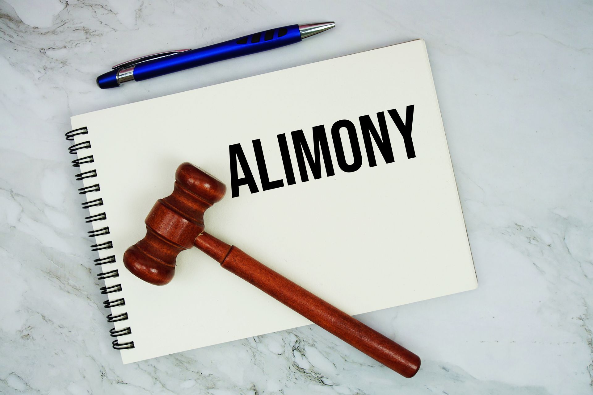Divorce judgement modification concept with gavel and alimony document on legal desk. Divorce judgement modification concept with gavel and alimony document on legal desk.