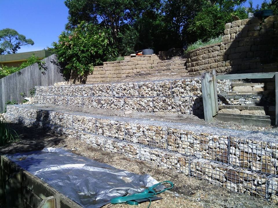 A Stone Wall With Stairs Leading Up to It — Seascapes Landscape Construction in Kendall, NSW