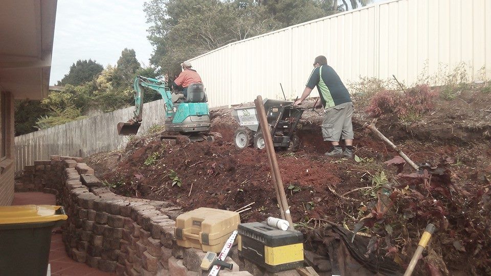 A Group of Men Are Working on a Construction Site — Seascapes Landscape Construction in Kendall, NSW
