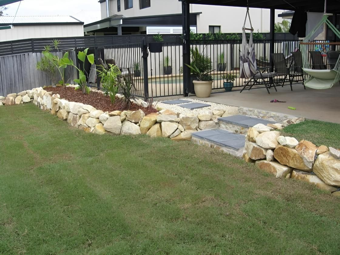 Soil Landscaping in Progress Beside a Garage Driveway — Seascapes Landscape Construction in Kendall, NSW