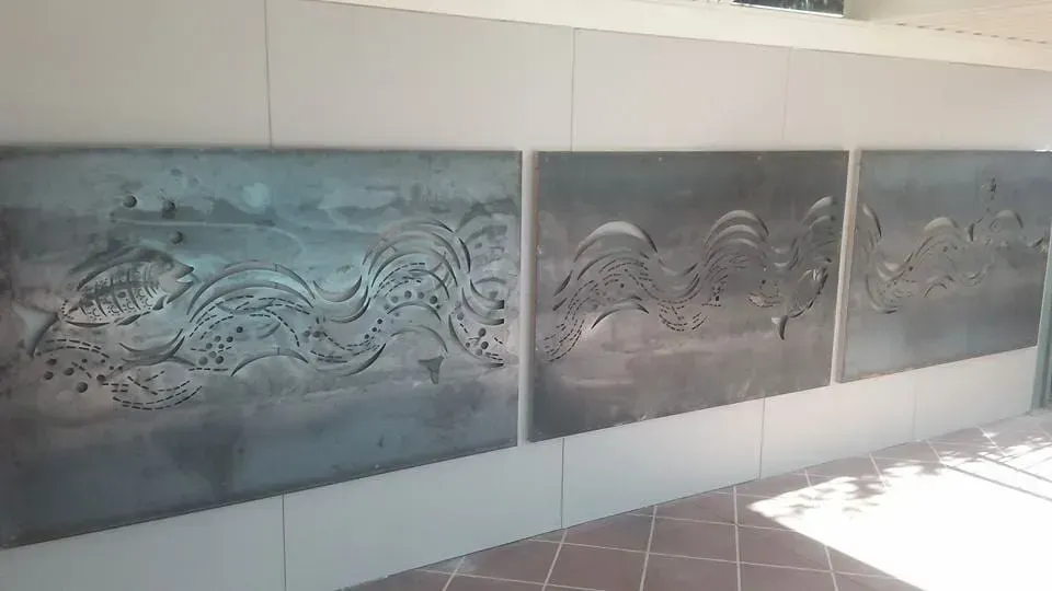 Three Paintings Are Hanging on a Wall in a Room — Seascapes Landscape Construction in Kendall, NSW