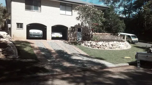 Two Cars Are Parked in the Garage of a House — Seascapes Landscape Construction in Port Macquarie, NSW