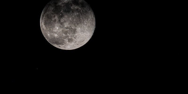 Detailed full moon against a black night sky