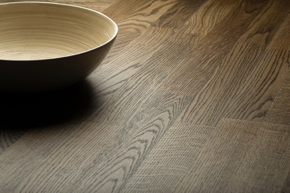 A Wooden Bowl Is Sitting on A Wooden Table — Finish It Floor Sanding in Bundaberg, QLD