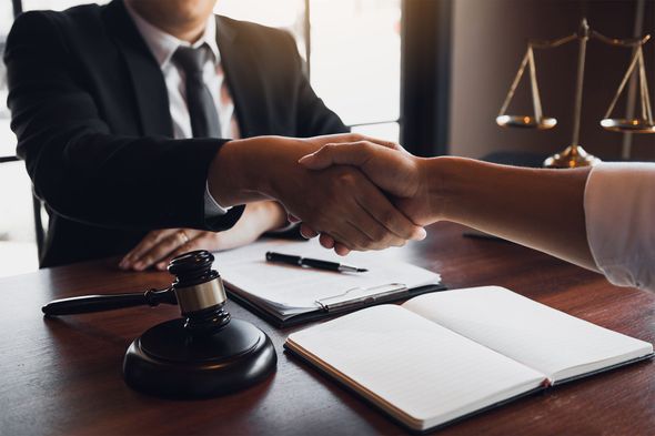 Attorney and Client Shaking Hands