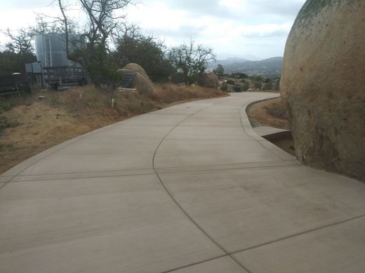 A large concrete slab is being built on a construction site.
