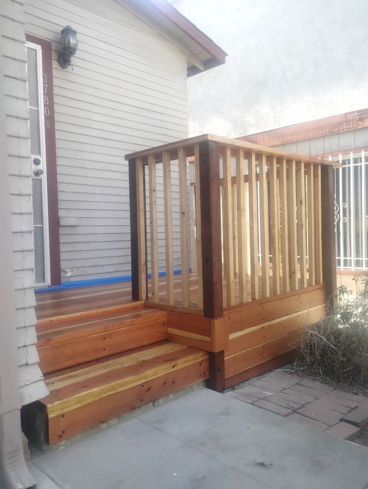 A house with a wooden deck and stairs