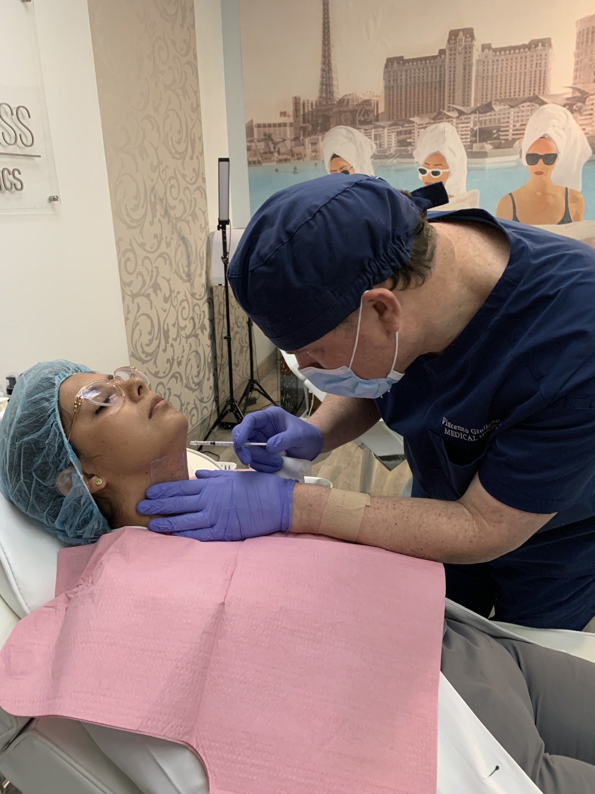 A doctor is giving a patient an injection in her neck