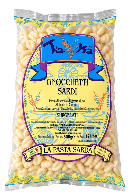 Confezione di pasta Gnochetti Sardi, pasta gialla a forma di conchiglia con etichetta blu e gialla.