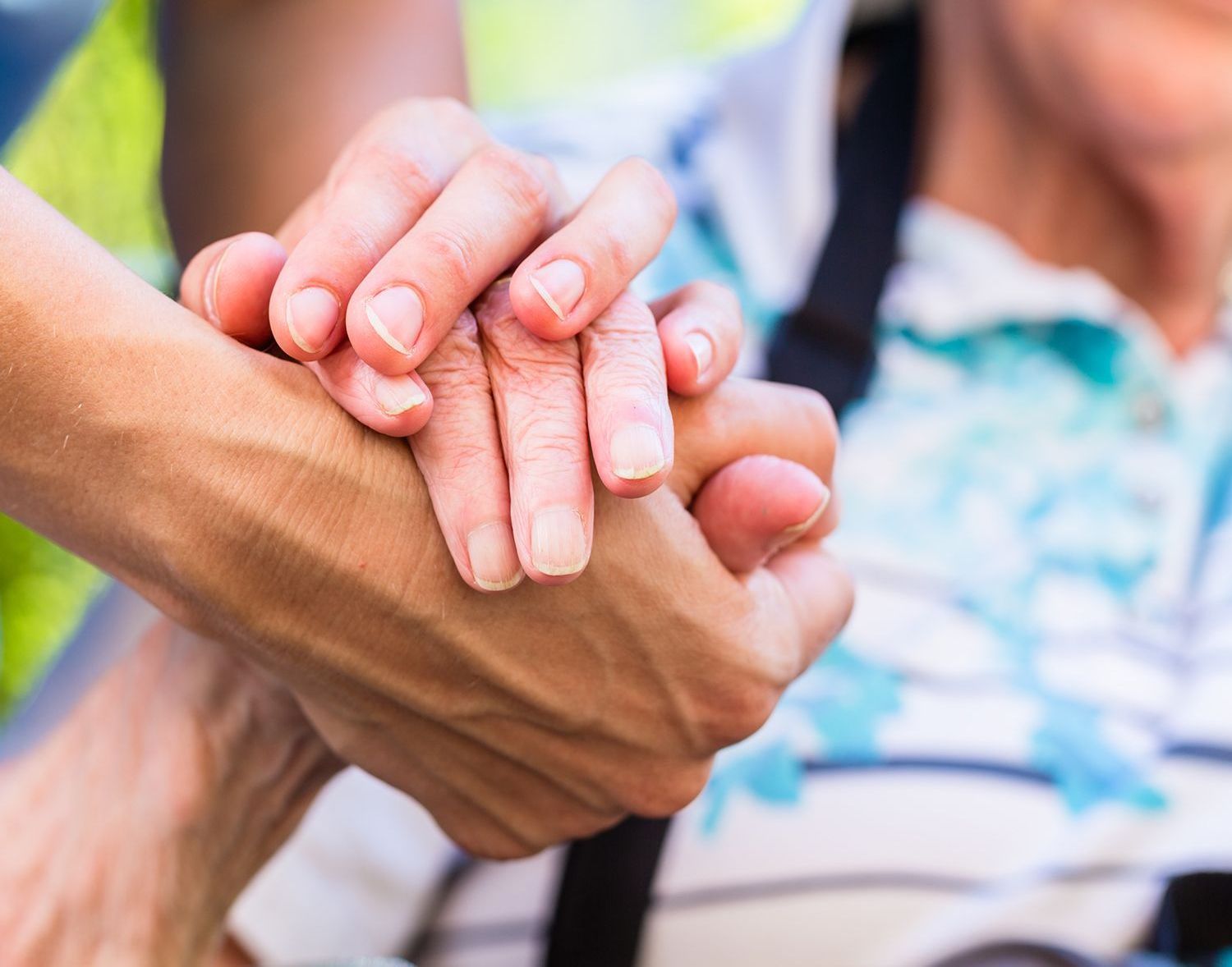 Various hands held together showing support