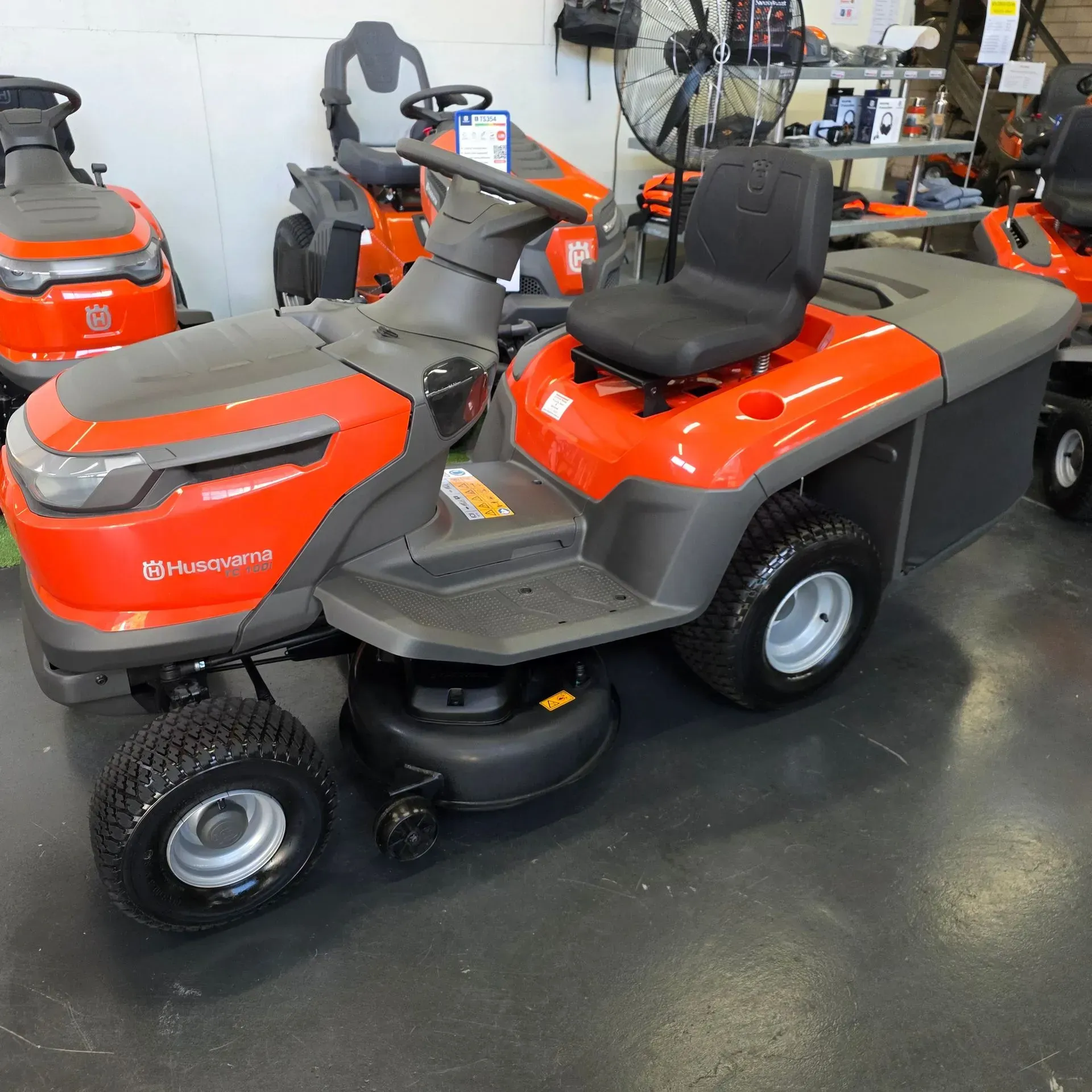 Orange and Gray Riding Lawn Tractor in a Showroom — Lift It Equipment in Tuggerah, NSW